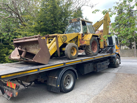 jcb excavator being collected and scrapped
